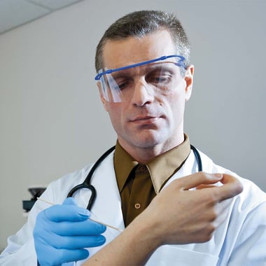 TIDIShield Flip 'n Go Eyewear in use on doctor treating patient
