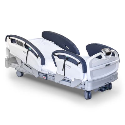 Stryker hospital bed fitted with Posey side rail pads