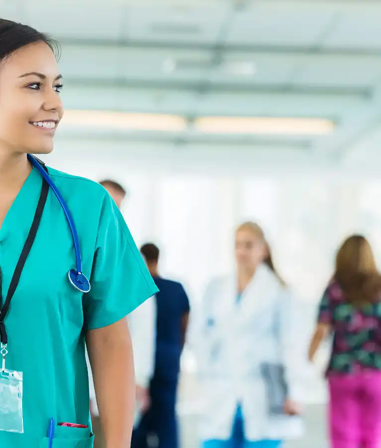 female_in_scrubs_walking_down_hall-767