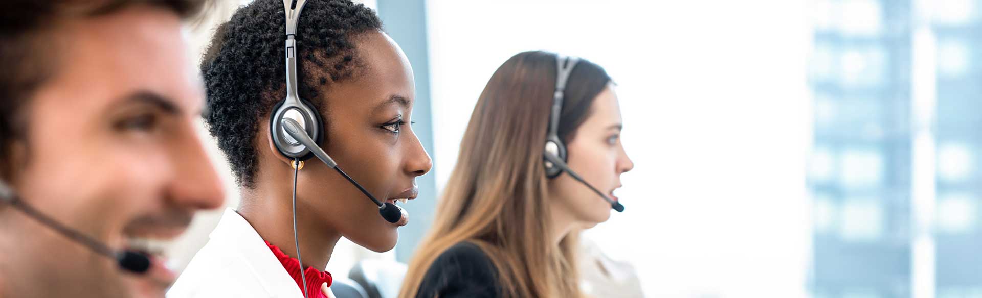 three_customer_service_reps_with_headsets